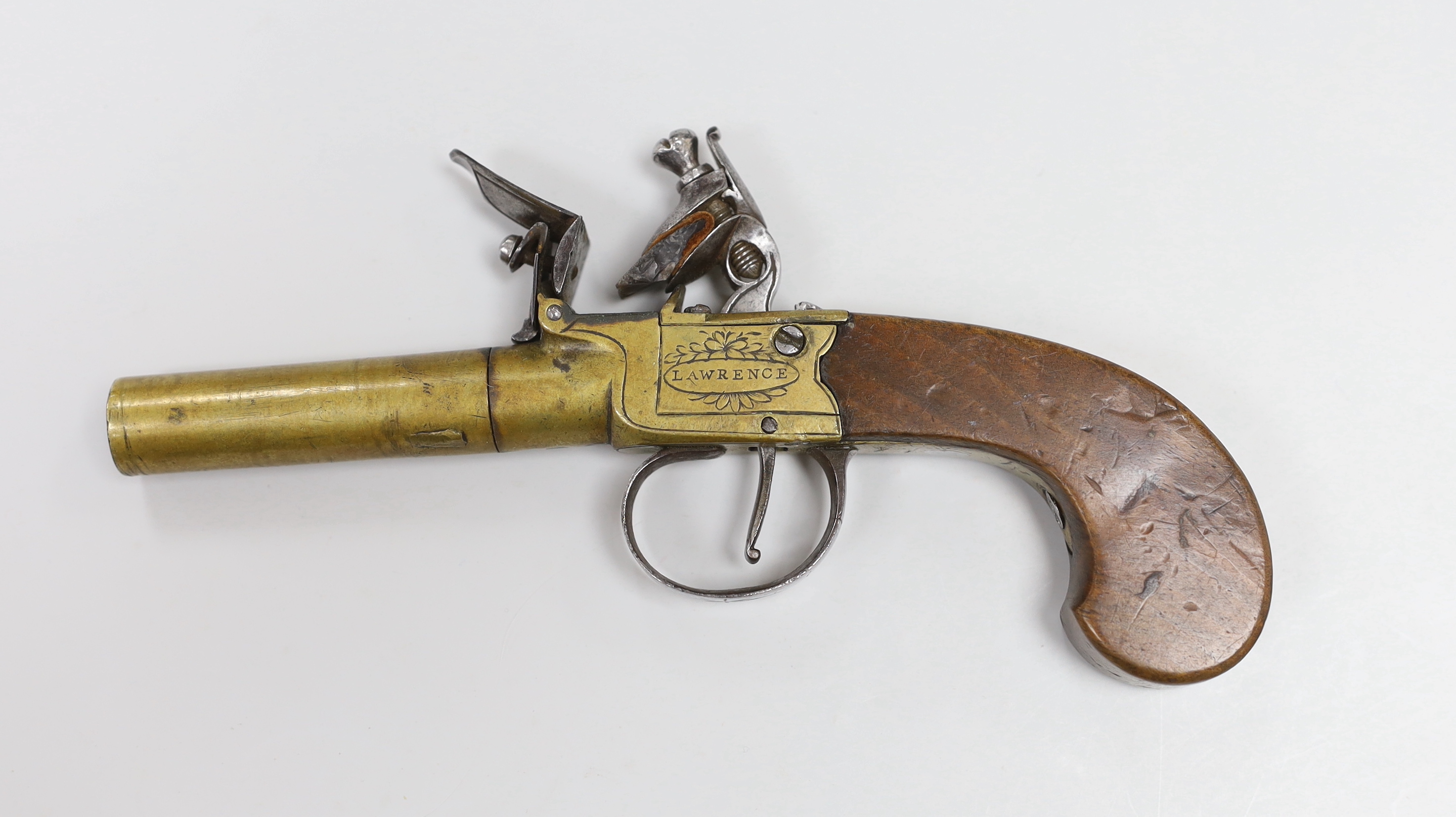 A George III flintlock pocket pistol, with turn off brass barrel, signed ‘Lawrence’